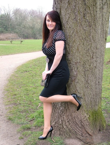 Office worker Jenna goes for walk on pathway to work in black pumps and hose 53553335