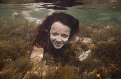 Petite redhead Korica A emerges from under the water with no clothes on 51763459