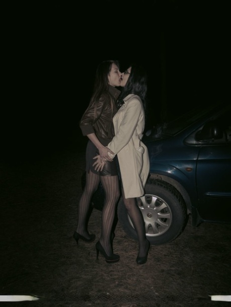 Lesbian lovers Helena J & Lexi B have sex inside of a car at night 26527847