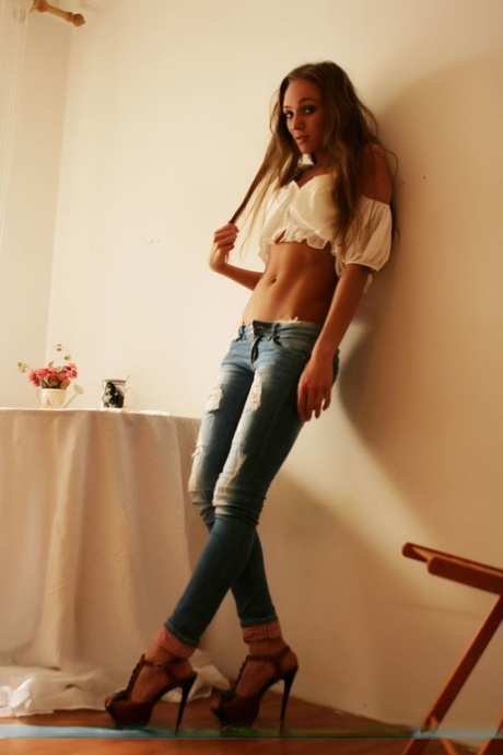 Sassy teen girl Tayra A strips off ripped jeans on way to modeling in the nude 60982702