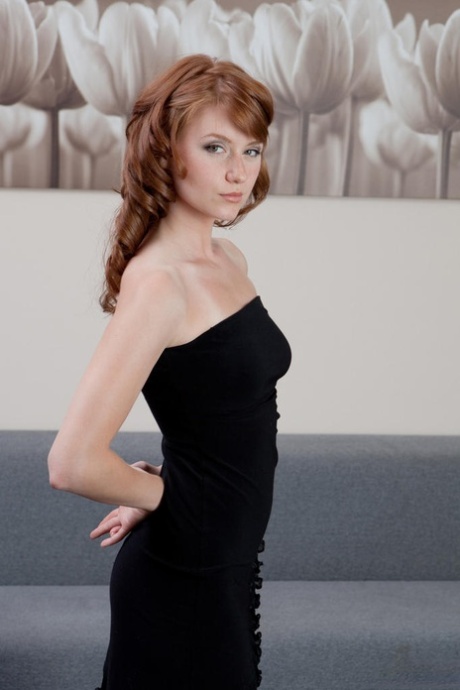 Natural redhead Nomi pulls down and hikes up her black dress to show her wares 48263515