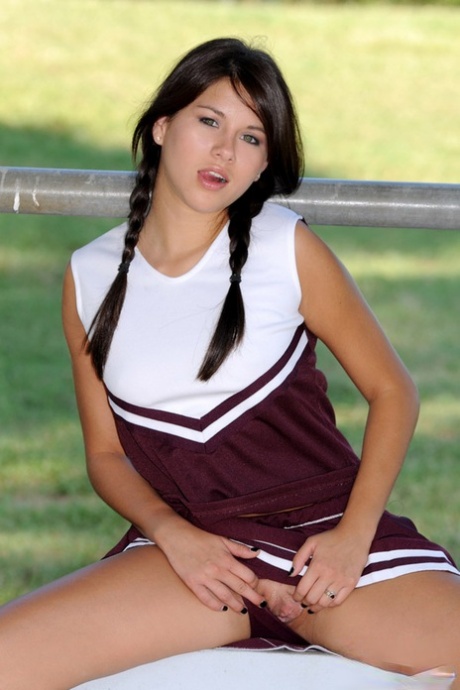 Pretty cheerleader Shyla Jennings casually exposes her snatch and nice tits 21847545