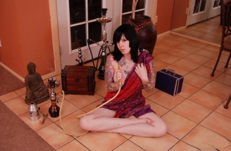 Naked brunette B4rbi3 assumes a lotus position while hitting a hookah pipe 25842122