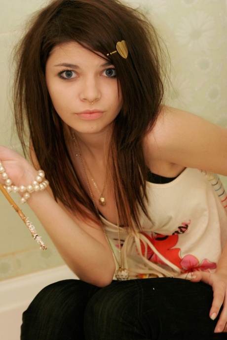 Tiny teen Kaira 18 scrunches up her face during a non nude shoot in a bathroom 24174711
