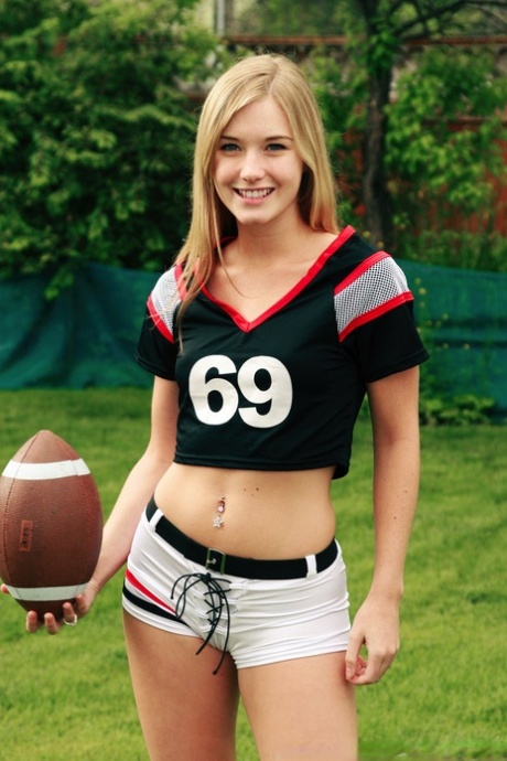 Beautiful blonde Jewel doffs sportswear to pose nude while holding a football 19567369
