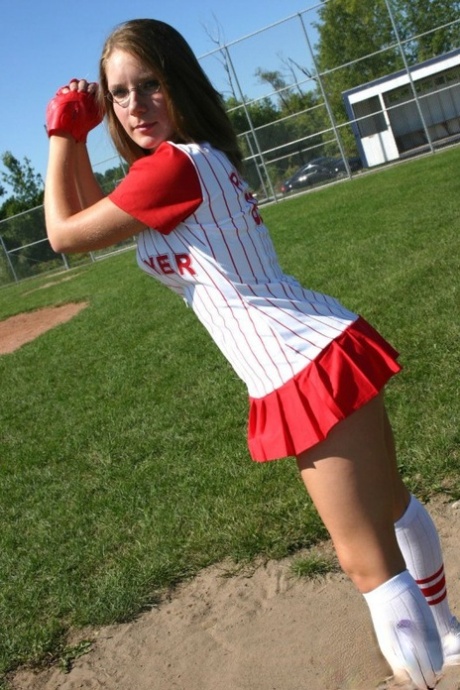 Sporty teen shows her bra and cleavage in a micro skirt baseball uniform 94968570