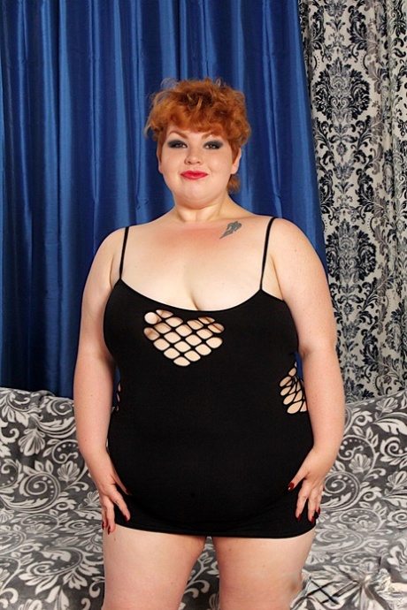 SSBBW with short red hair Velma Voodoo draws attention to her bald pussy 84022624