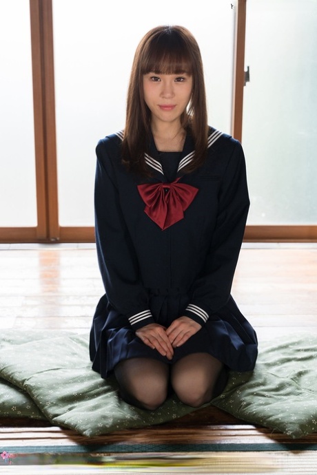 Japanese student releases her slim body from her school outfit on a cushion 89937293