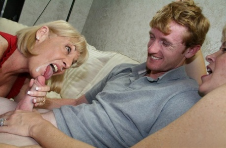 Older blonde lady sucks a young boy's dick while his mother watches 48624142