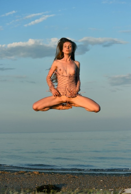 Totally naked girl Leanne J displays her athletic abilities in the ocean 24749719