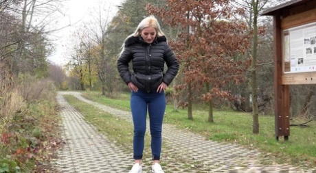 Blonde European pisses on a path on a trail 69658143