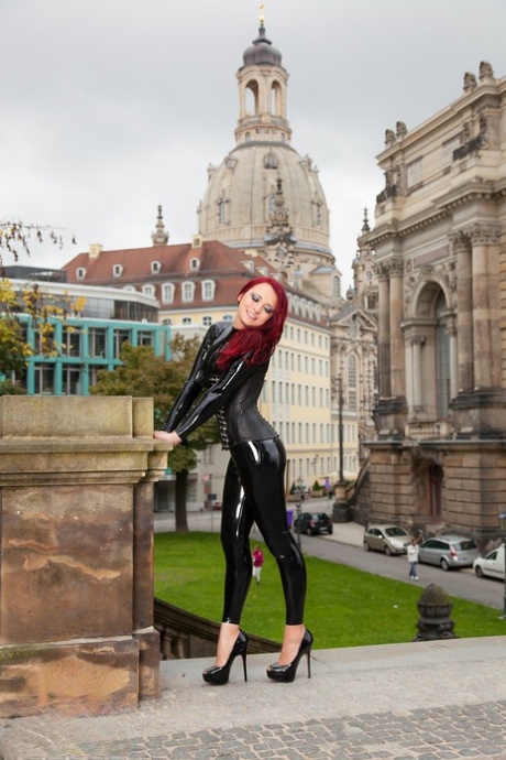 Clothed redhead Lara Larsen models latex attire and high heels in public 10402507