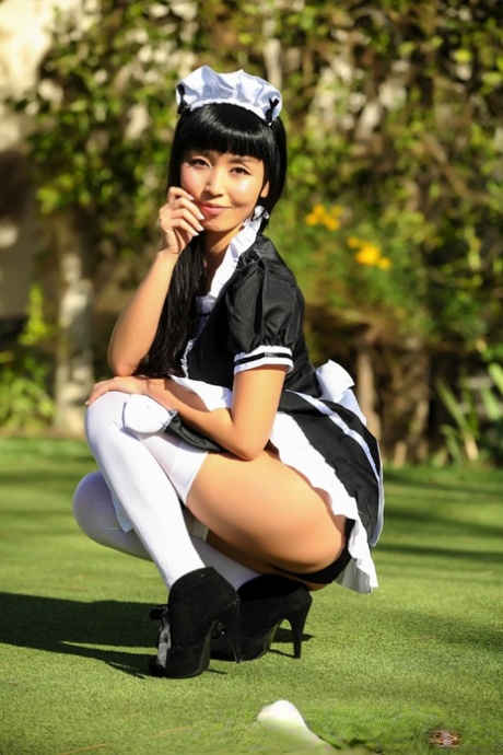 Japanese maid Marica Hase exposes her tits and twat on a putting green 81374331