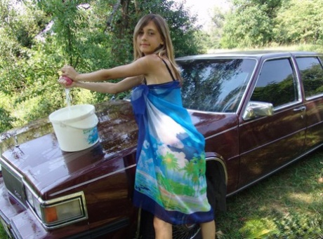 Young girl strips to her bra and panties while washing a vintage automobile 26053943
