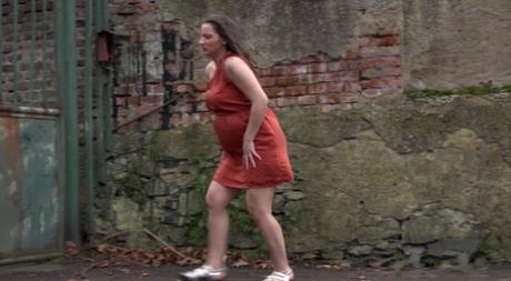 Pregnant Nicolette Noir pisses outside in city 10709750
