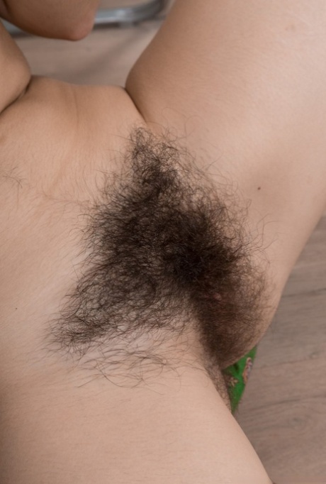 Dark haired Ole Nina removes her white pantyhose to reveal her very hairy muff 17012598