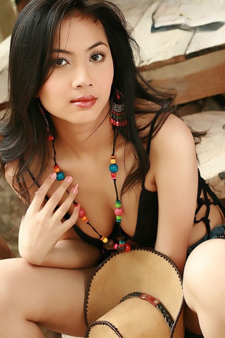 Pretty Thai girl Christy Hunsa shows her tits & twat while wearing a straw hat 53129297