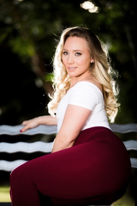 Blonde solo girl AJ Applegate rips off her leggings and onesie on the patio