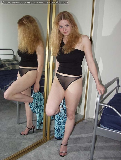 Amateur model Heidi disrobes afore a mirror before spreading her labia lips 19379726