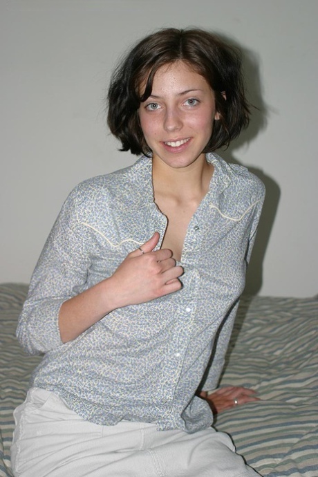 Brunette amateur Nico finger spreads her trimmed pussy after disrobing on bed 43351099
