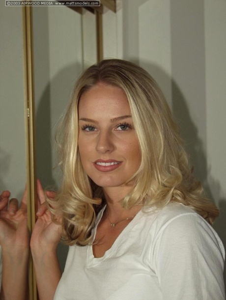 Blonde amateur Jordan West strips naked in front of bedroom mirror 41300339