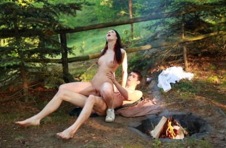 Dark haired young girl and her boyfriend have sex near an open pit fire 28997103