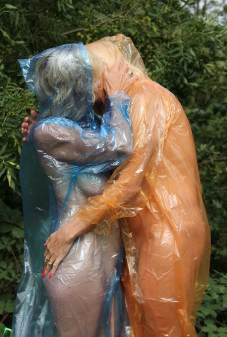 Blonde amateur Dimonty and her lesbian lover flash while wearing raincoats