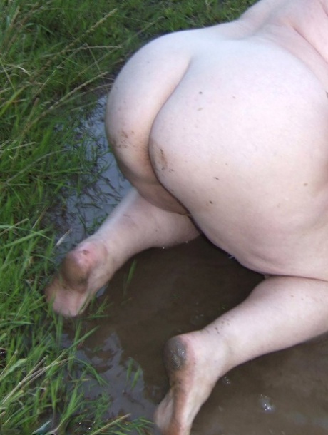 Fat nan Grandma Libby steps into a puddle before covering herself in mud 70231508
