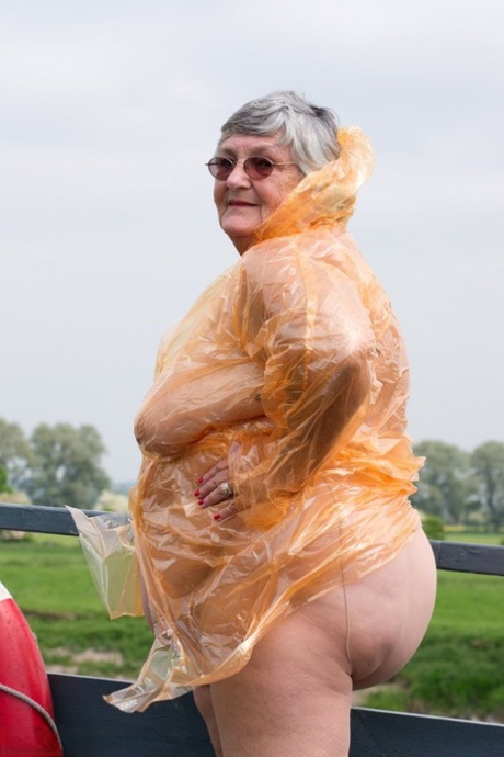 Obese oma Grandma Libby doffs a see-through raincoat to get naked on a bridge 73319832