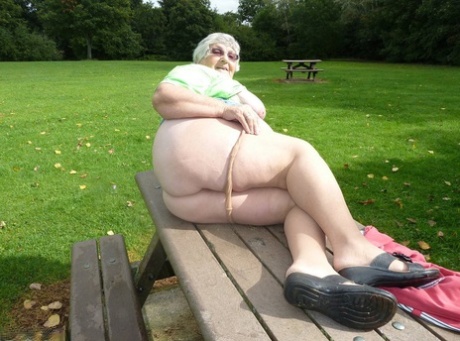Obese oma Grandma Libby exposes her large tits and butt on a picnic table 29781578
