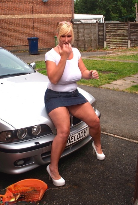 Big titted blonde amateur Melody soaks a white T-shirt while washing her car 71509157