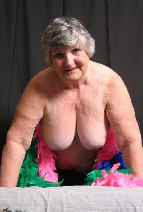 Fat UK amateur Grandma Libby shows her big tits while draped in feather boas 83481473