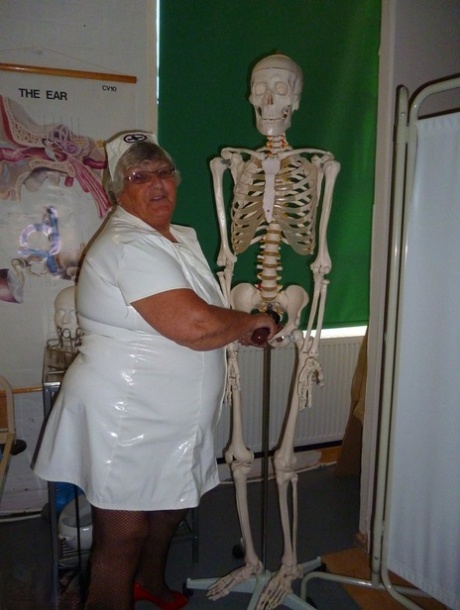 Fat old nurse Grandma Libby attaches a dildo to a skeleton for sexual relief 89405339