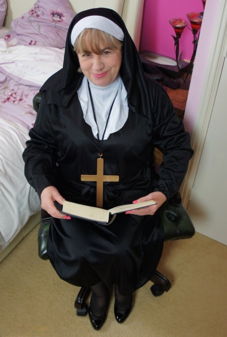 Mature nun Speedy Bee and partakes in strapon lesbian sex with another nun 92957803