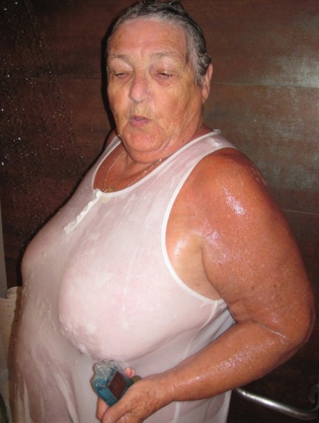 Obese amateur Grandma Libby blow drys her hair after taking a shower 94376629