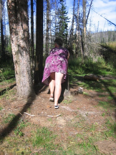 Fat granny Girdle Goddess loses her purple outfit in the woods and poses nude 52610355
