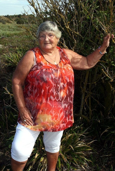 Obese nan Grandma Libby strips totally naked out by evergreen trees 80172538