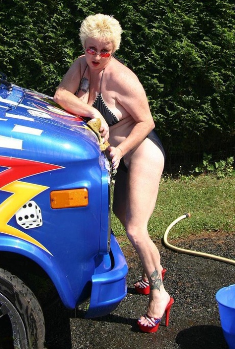 Mature blonde Mary Bitch gets bare naked while washing a class B motorhome 80540451