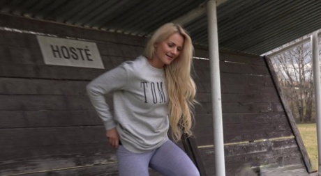 Blonde girl Katy Sky pulls down her leggings before pissing on a soccer bench 68157139