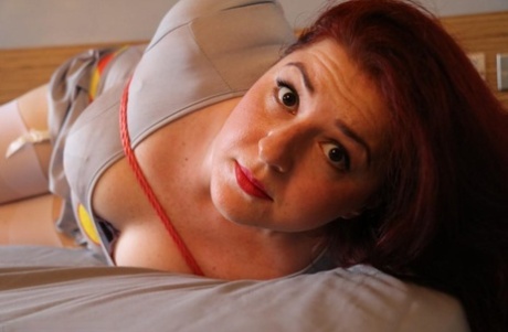 Natural redhead is left on a bed while tied up and gagged 50930960