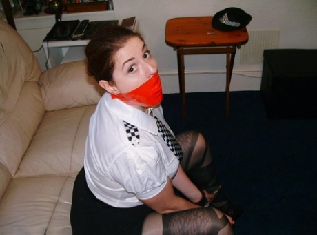 British policewoman is silenced with a gag while having her wrists restrained 61192891