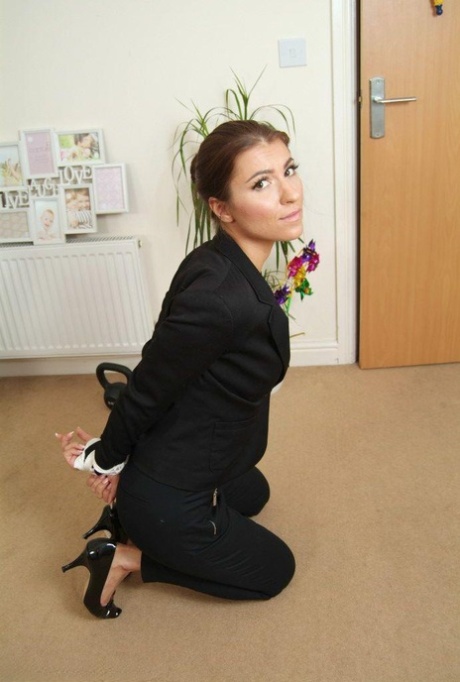 Fully clothed British secretary is tied up with rope in reception area 36568896
