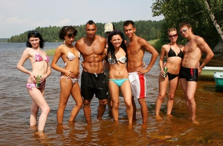 College students take part in group sex at the lake while on vacation 27773193