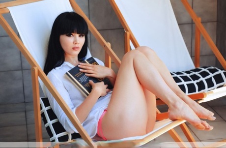 Beautiful teen with dark hair Malena F gets totally naked after reading a book 47983594