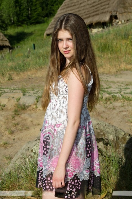 Teen solo girl Karmen F slips off her sun dress to model naked on a sunny day 55293388