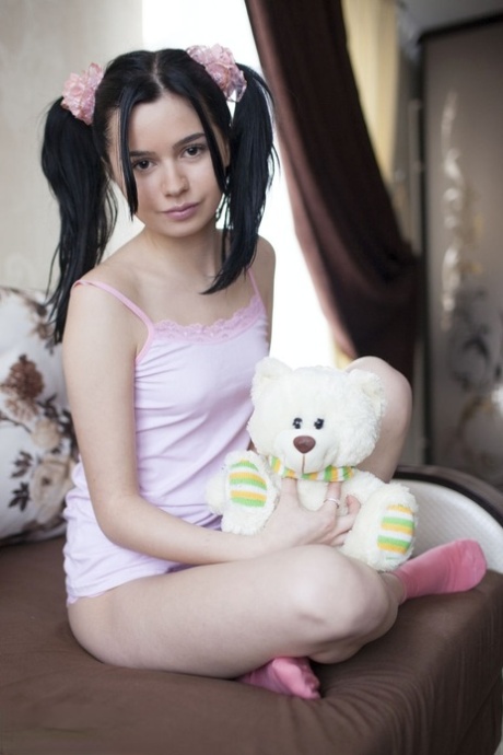 Cute teen Rozie shows her tight slit after putting down her plush toy 10576315