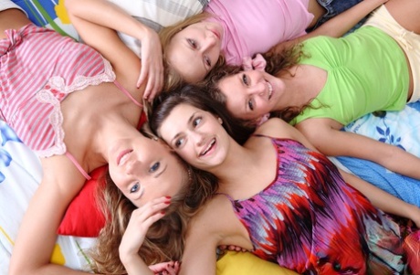Young girls gather on a bed for a lesbian foursome after classes are out 84049442