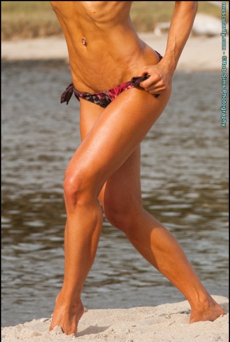 Skinny blonde Jennifer Hennessy models a bikini while at the beach 72898870