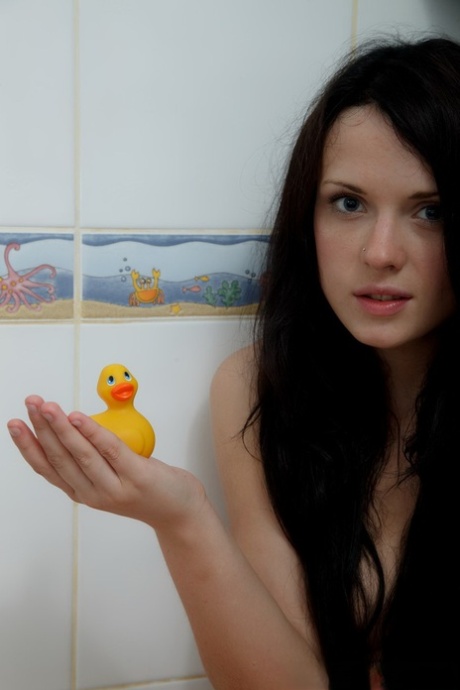 Dark haired teen Silver holds a rubber duckie while naked in the shower 84958278