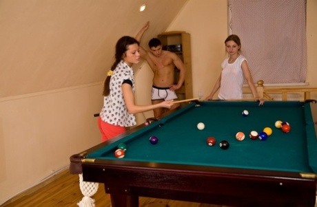 Young girls Angela and Lily have a threesome after shooting pool with a boy